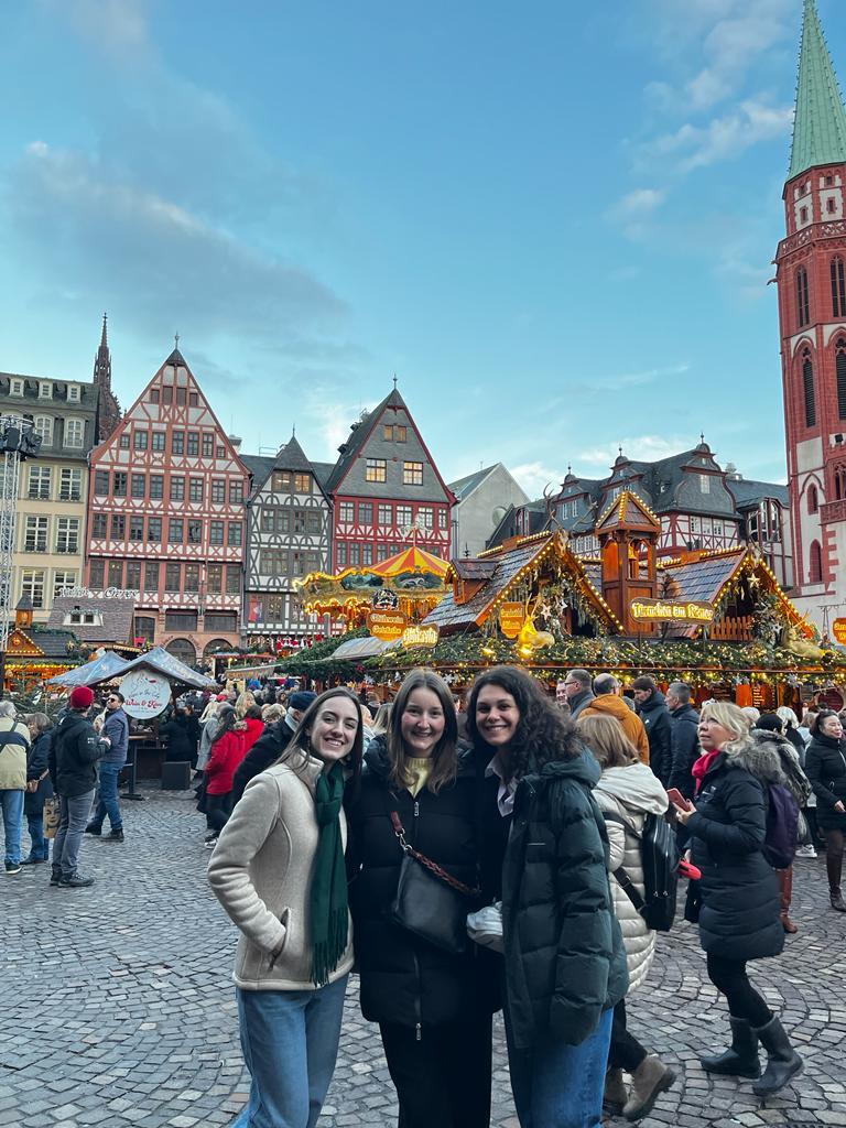 Valerie and friends in an outdoor Christmas market