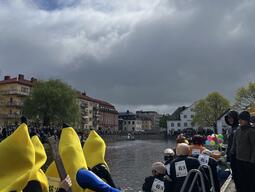 A university rowing club in funny costumes like a banana suit