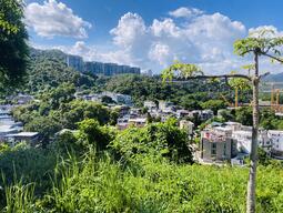 View of city skyline and rolling hills