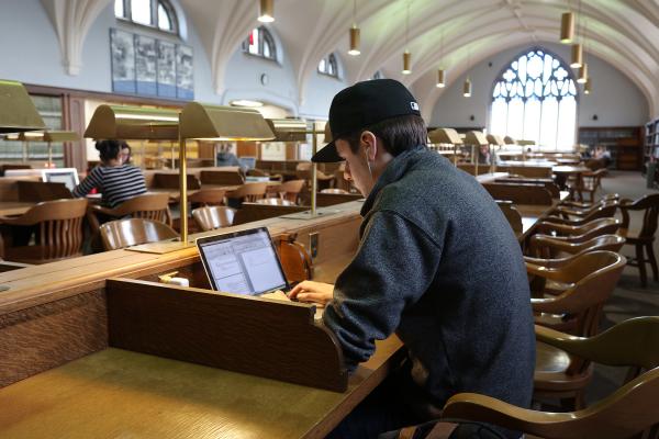 Student studying off of computer in Douglas Library 