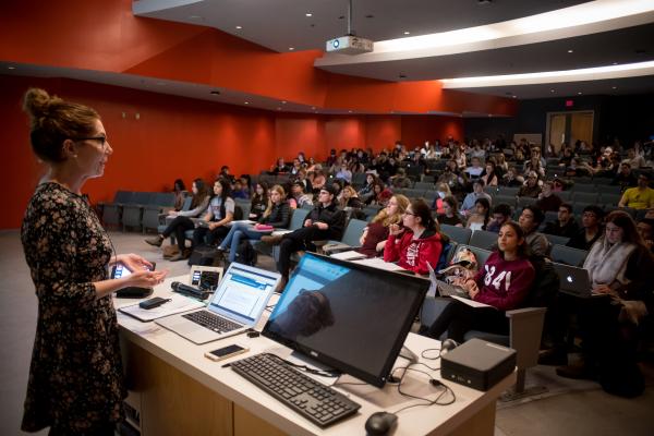 Professor delivering lecture to students in the Biosciences Auditorium 