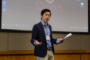 Sho delivering a presentation at ECS 2023.