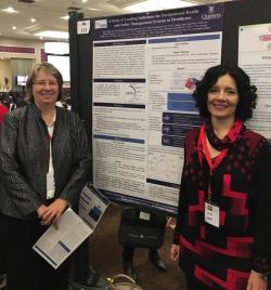Joan Almost presenting a poster at the International Conference on Violence