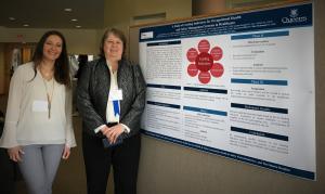 Joan Almost and Vanessa Silva presenting a poster at the Kingston Nursing Research Conference
