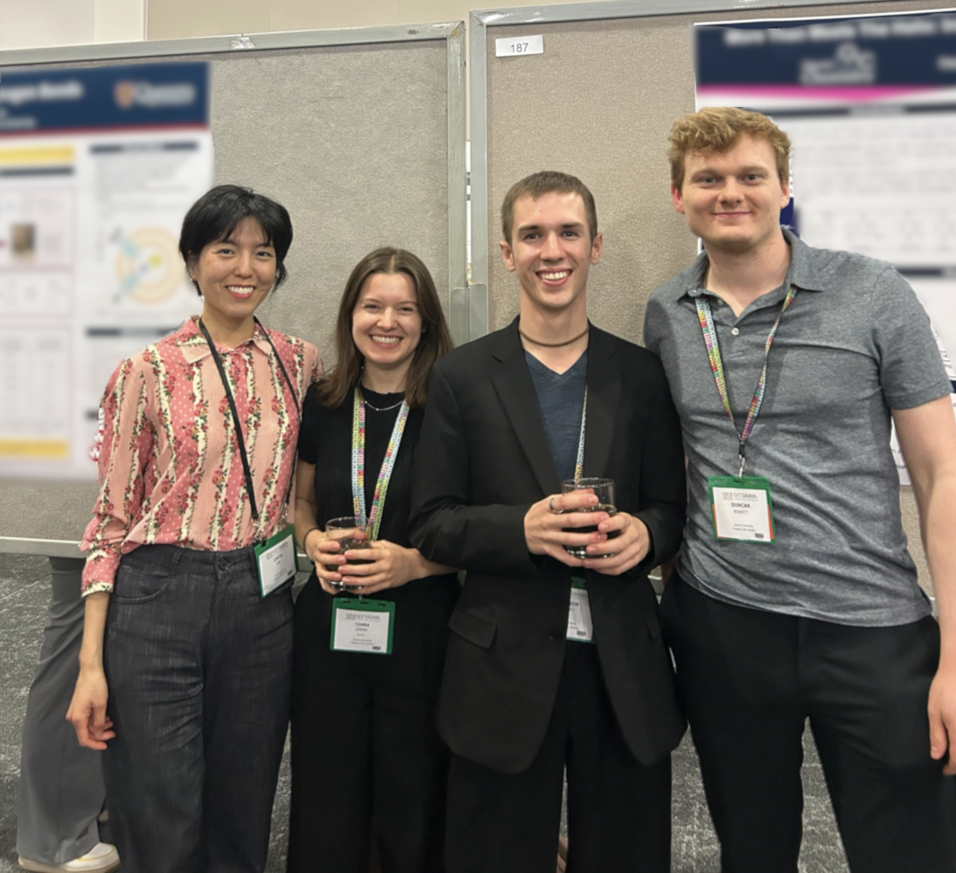 Lucia, Ciara, Jack, and Duncan standing by their posters at CSC 2025