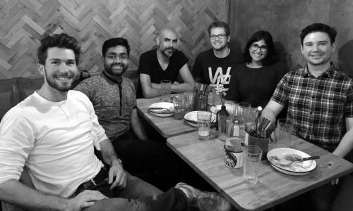 A group of people gathered around a table