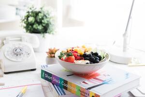 Bowl of food on books 