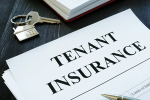 photo of tenant insurance papers with a set of keys beside. 