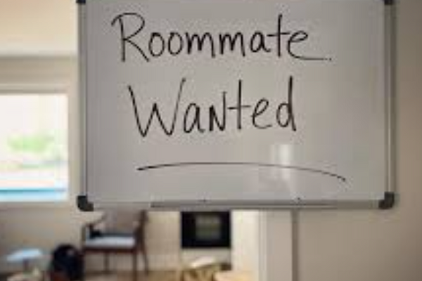 wipe board with the text "Roommate Wanted"