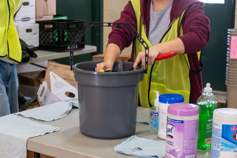 volunteer cleaning donated items before putting them out on the floor