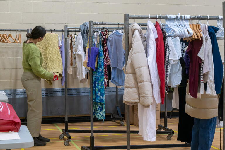 student picking up donated items