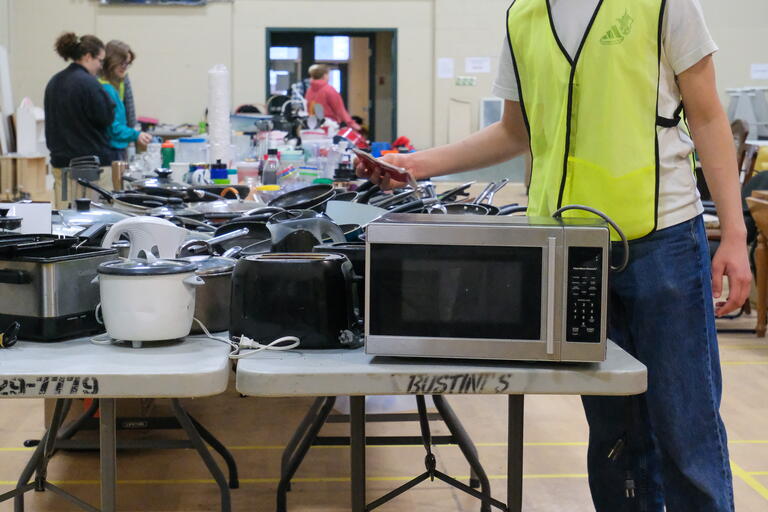 volunteer organizing donated items