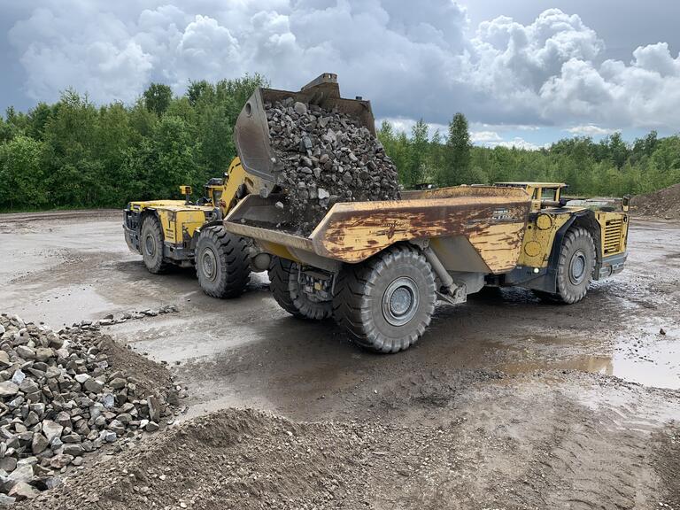 Loader dumping in truck.
