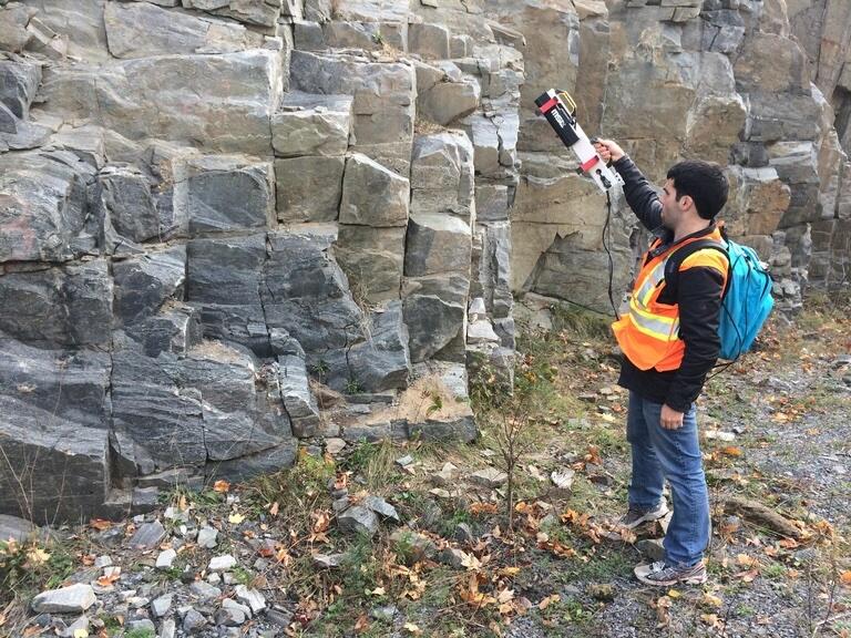 Marc Gallant scanning a rock cut with AxixMapper.