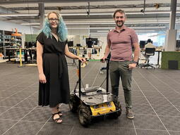 Emily and Thomas working on a Husky at Ingenuity Labs