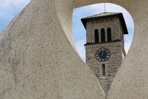 View of Grant Hall at Queen's seen through a sculpture
