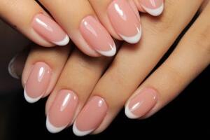 Hands with french manicure nails