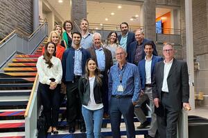 A delegation of Queen's, Kingston Economic Development and SUNY visitors on Queen's campus.