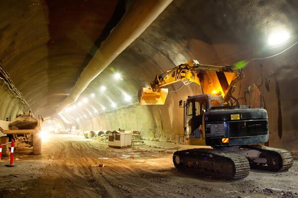 Mining tunnel with machinery driving through it