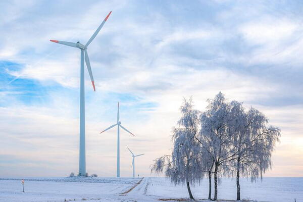 wind turbines in a winter landscape setting