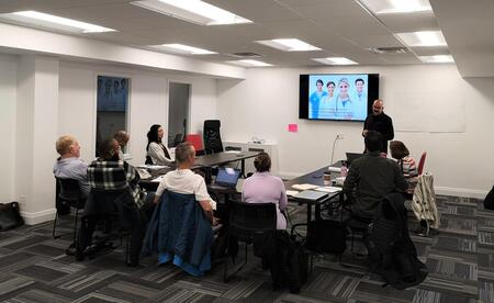 Wings participants sitting in the boardroom during the program