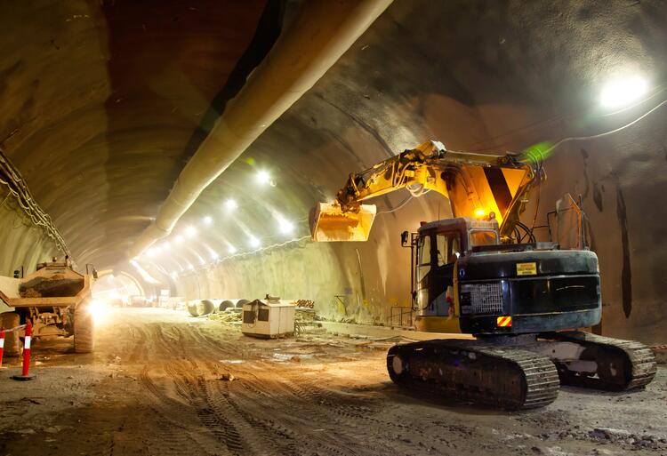 A large construction machine in a mining tunnel