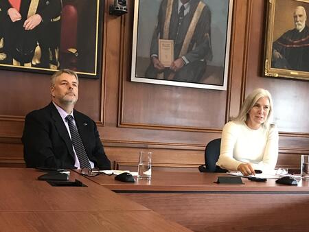 Jim Banting and Nancy Harrison sit at a desk in Richardson Hall