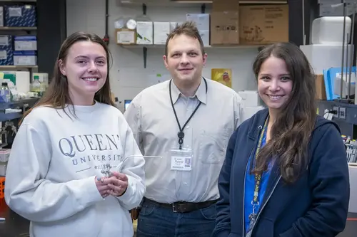 Grad student Kaytlin Andrews with Drs. Jamie and Teresa Purzner in the lab