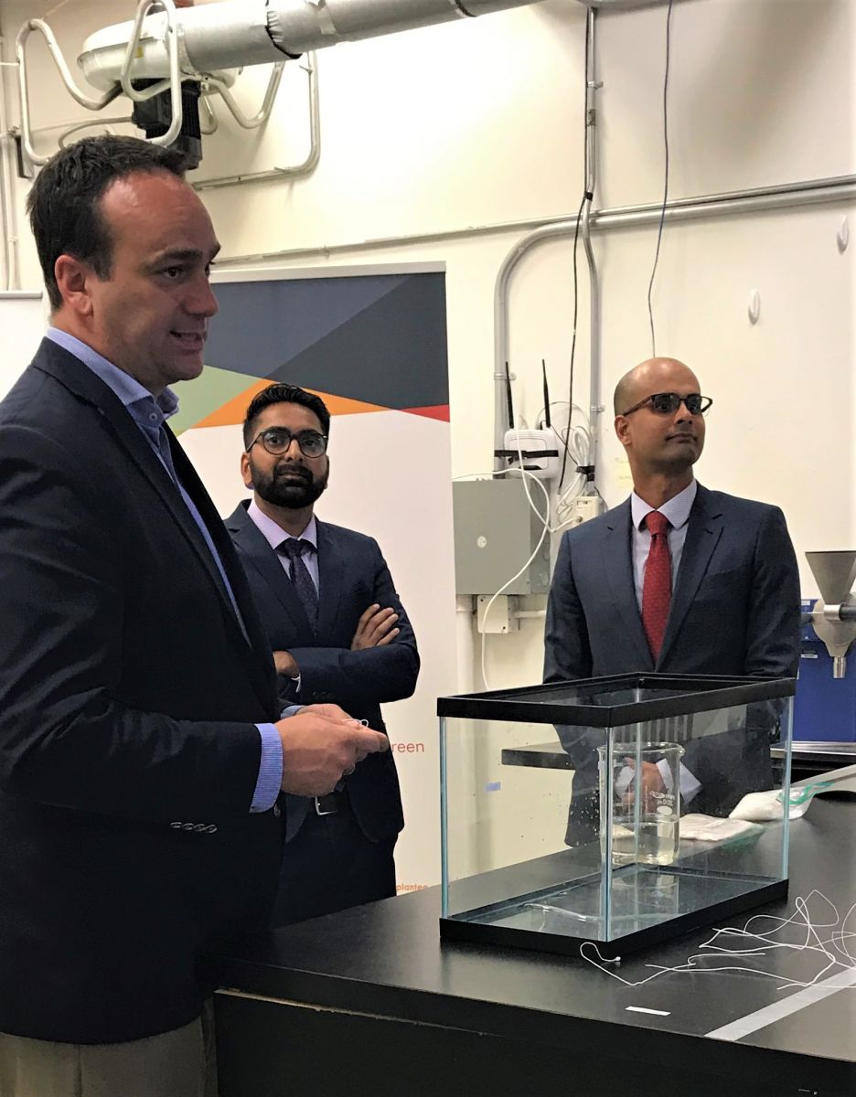 Plantee Founders Prashant Agrawal (middle) and Praphulla Tiwary (right) show their product to Member of Parliament for Kingston and the Islands, Mark Gerretsen.