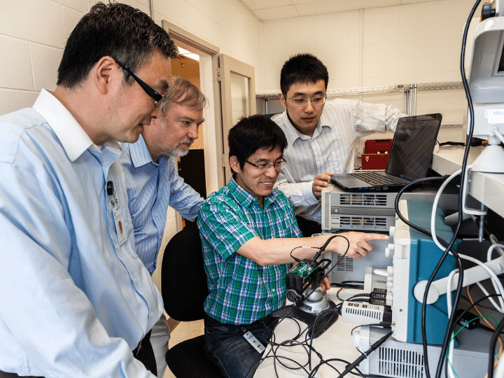 Dr. Yan-Fei Liu, Mr. Doug Malcolm, Dr. Laili Wang and Mr. Tianshu Liu at Sumida's Innovation Park laboratory.