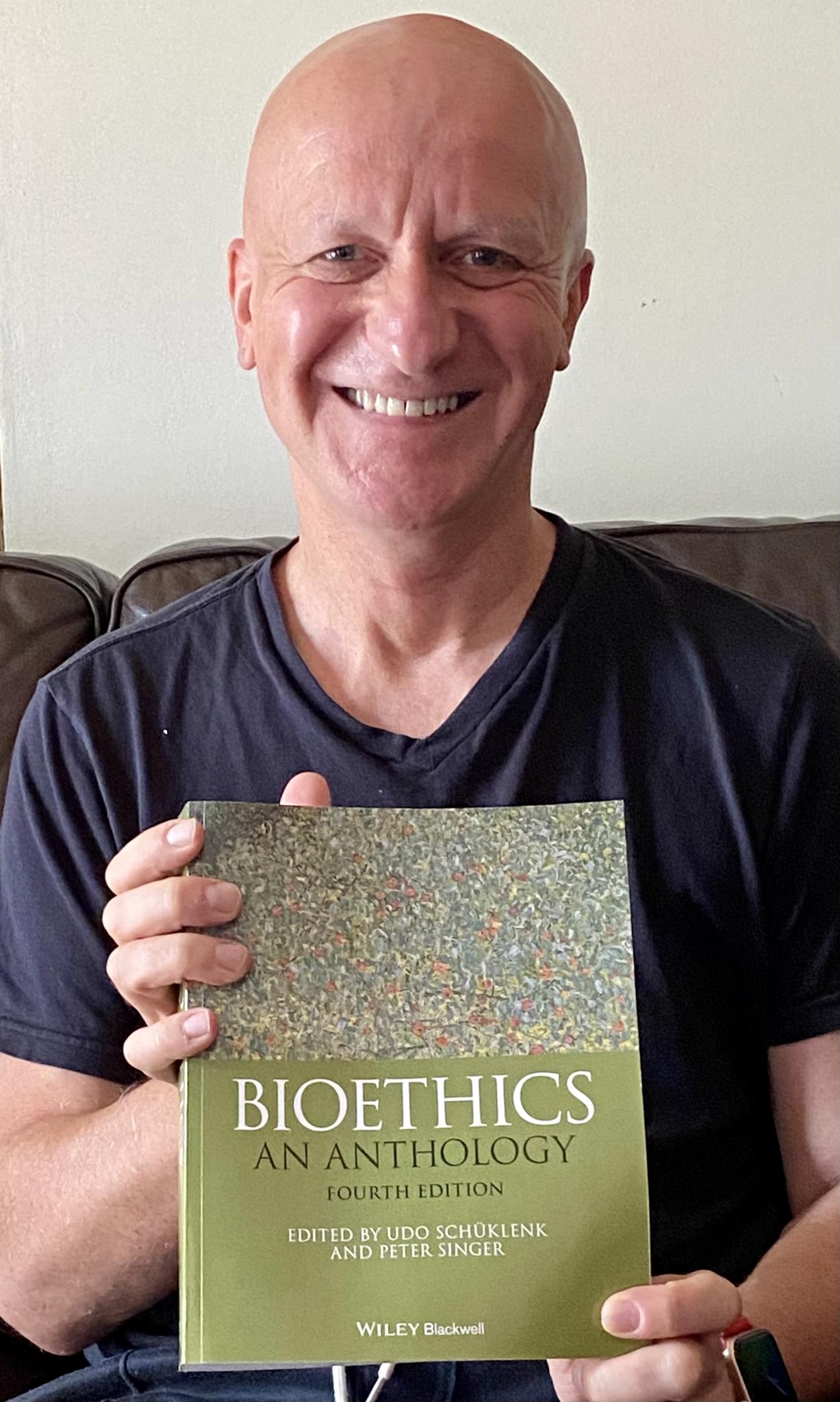 Udo Schüklenk with the Fourth Edition of Bioethics: An Anthology.