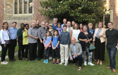 Udo Schüklenk surrounded by conference participants and their families.