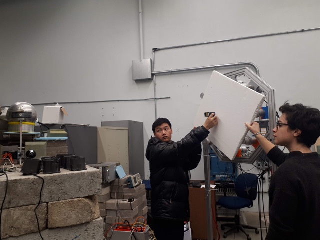 Long Li, graduate student at Duke and Marie Vidal, recording the distance between the backing detectors and the SPC.