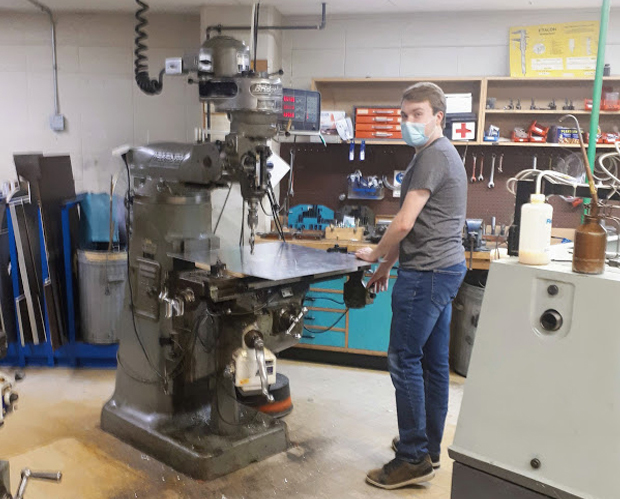 Summer student Carter Garrah working in the machine shop on an exciting project – details to come soon!