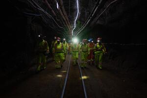 Dr. Nancy Ross, Vice-Principal (Research) accompanies Queen's Emeritus Professor and Nobel Laureate Arthur McDonald, Minister François-Philippe Champagne, local Members of Parliament, and SNOLAB administration on their way to the facility 2 km underground to announce the Canada Foundation for Innovation's 2022 Major Science Initiatives Fund. [Credit: Gerry Kingsley; CFI]