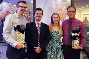 Jonathan Corbett and Julia Puistonen awarding Prof. Bob Gooding and Prof. Ryan Martin at the Physics Teaching Award night 2018-2019 academic year.
