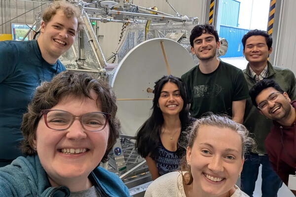 Prof. Laura Fissel from Queen's Physics Department and members of the  Balloon-Borne Very Large Baseline Interferometry Experiment (BVEX) student team with the balloon-borne radio telescope system they are helping to design and build.