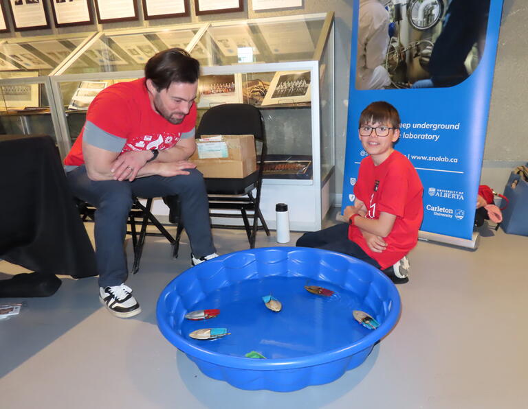 Candled powered steam boats in the Sensory Science zone at 2026 Science Rendezvous Kingston.