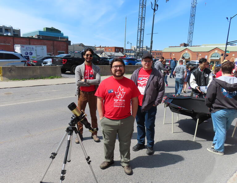Some of our volunteers with one of the solar telescopes at the outdoor station at the 2026 Science Rendezvous Kingston.