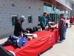 The outdoor station featured sidewalk chalk drawings, a demonstration of the distance scales in the Artemis II lunare mission, and a working radio telescope made from a cooking work at the 2026 Science Rendezvous Kingston.