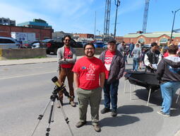 Some of our volunteers with one of the solar telescopes at the outdoor station at the 2026 Science Rendezvous Kingston.
