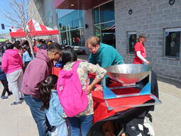 Volunteer Felix Thiel explains the radio telescope at the 2026 Science Rendezvous Kingston.