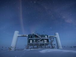 The IceCube Laboratory at the Amundsen-Scott South Pole Station, in Antarctica, hosts the computers collecting raw data. Due to satellite bandwidth allocations, the first level of reconstruction and event filtering happens in near real time in this lab. Only events selected as interesting for physics studies are sent to UW-Madison, where they are prepared for use by any member of the IceCube Collaboration. [Credit: Felipe Pedreros, IceCube/NSF]