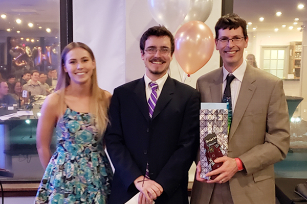 Prof. James Fraser with Jonathan Corbett and Julia Puistonen