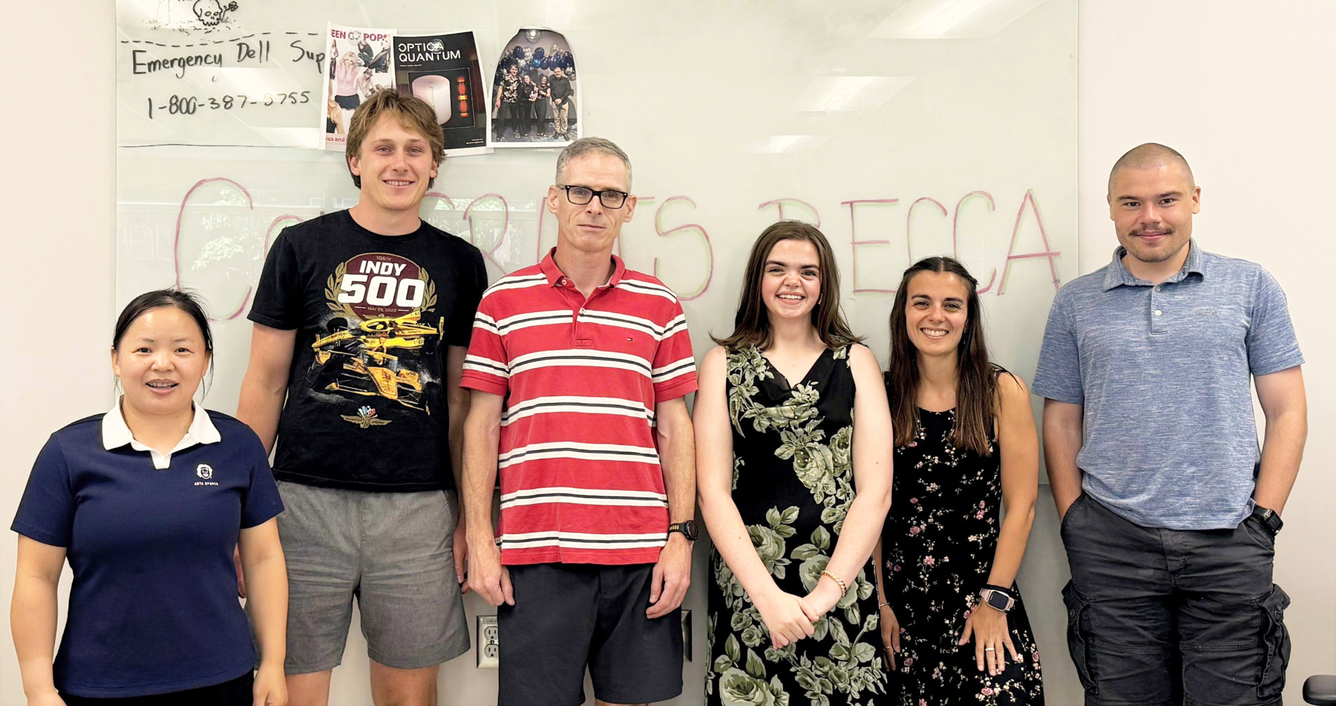 Professor Hughes and research group grad students.