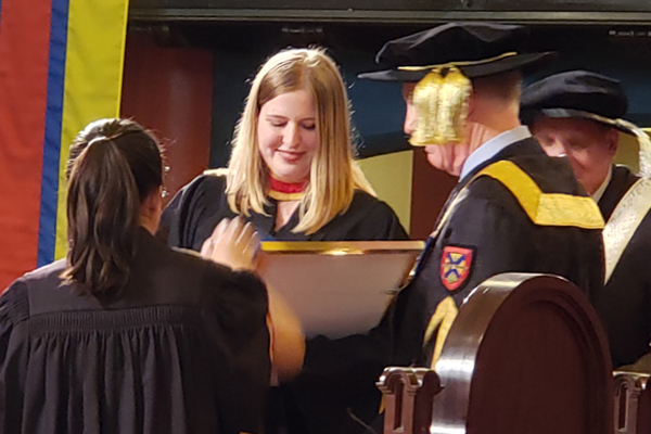Erin Crawley receiving one of her four medals at the 2019 Convocation
