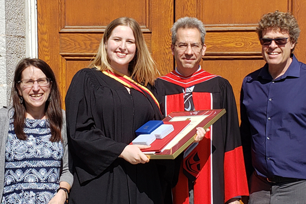 Erin Crawley with her parents and Prof. Marc Dignam, Department Head of Physics, Engineering Physics & Astronomy.