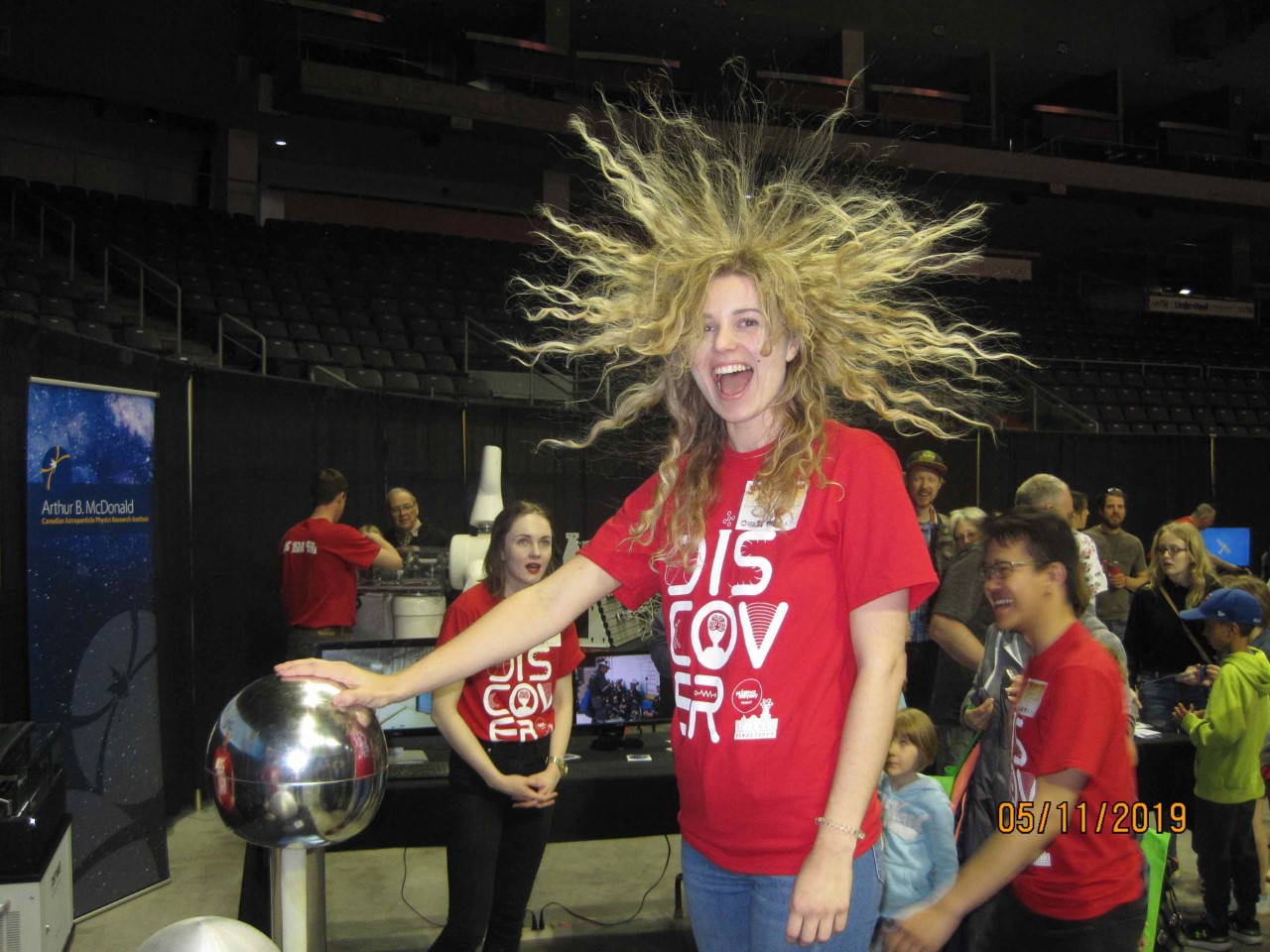 Graduate student Ingrida Semenec (centre) tests out the van de Graaf generator