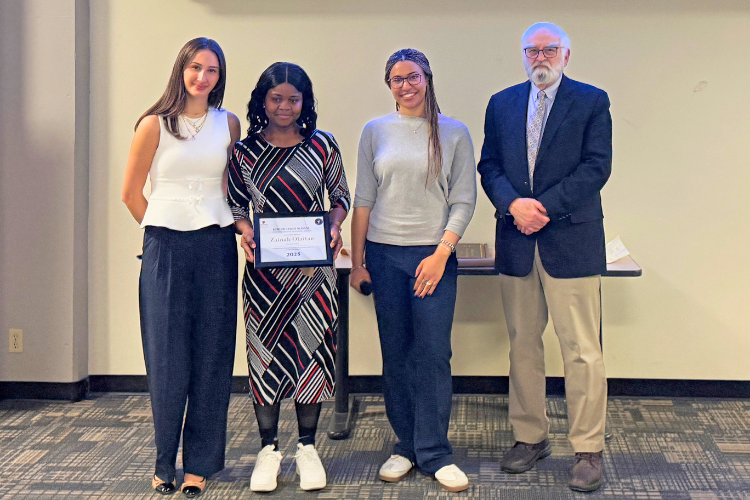 2025-2026 honourable mention recipient, Zainab Olaitan (second from left), with Kim Richard Nossal (right), and DSC Co-Presidents Sofia Guido (left) and Greta Speidel (second from the right)