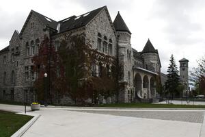 Side view of the exterior of Ontario Hall during fall season.